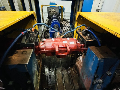 The drive axle of the excavator-loader undergoes rigorous bench testing